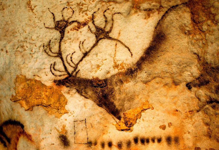 In the famous French cave of Lascaux, ancient artists did more than decorate the walls with images of animals. They also left mysterious geometric signs such as the black quadrangle and dots below this Ice Age deer. 
