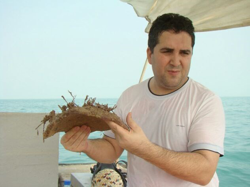 Hossein Tofighian with a large Sassanid-era pottery fragment from the sea-bed. 